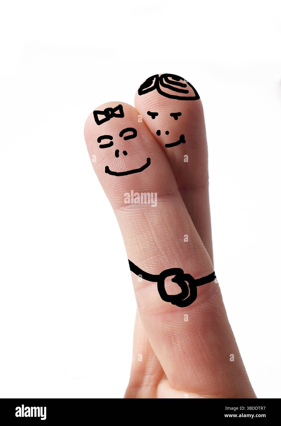 Deux doigts sur le blanc, symbole de l'amour en couple Banque D'Images