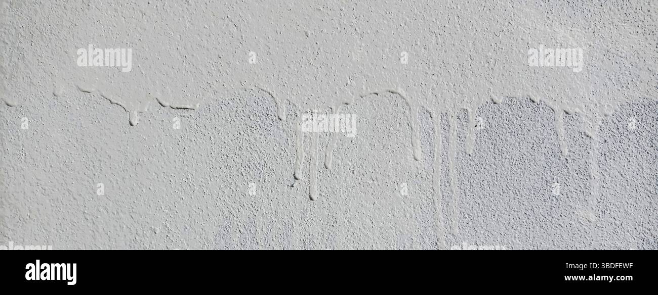 Mur de ciment avec des gouttes blanches Banque D'Images