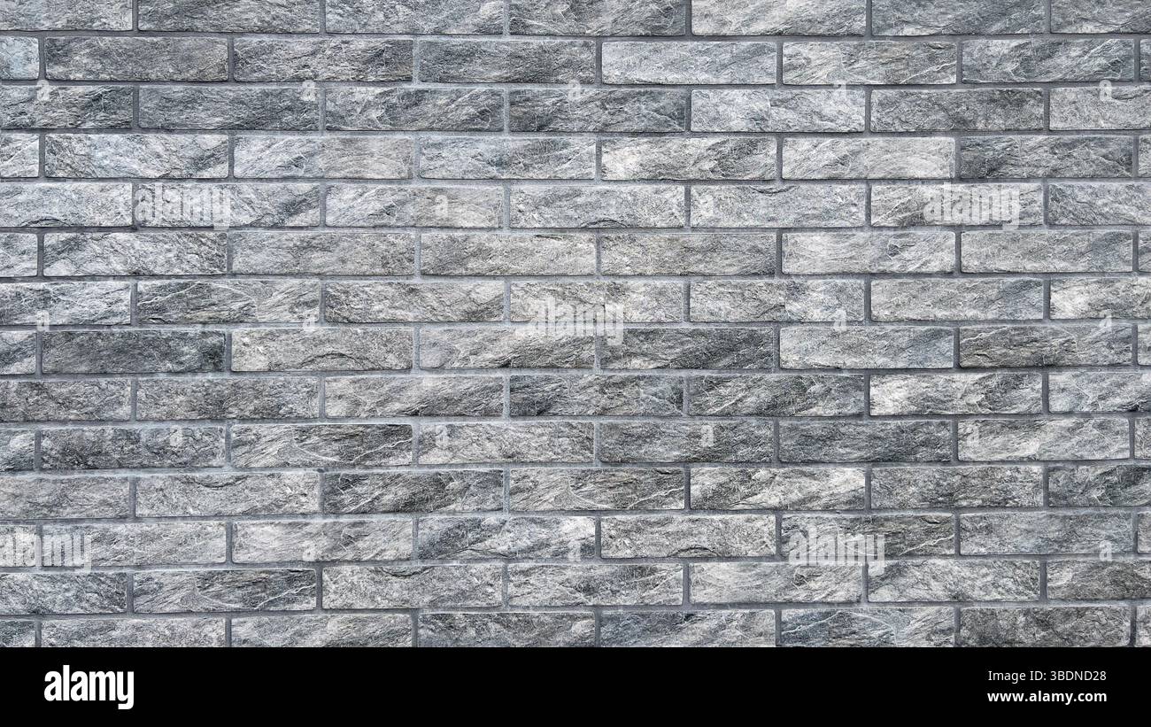 Le fond est un mur de briques gris artificiellement vieilli. - Image de stock capturée avec un smartphone