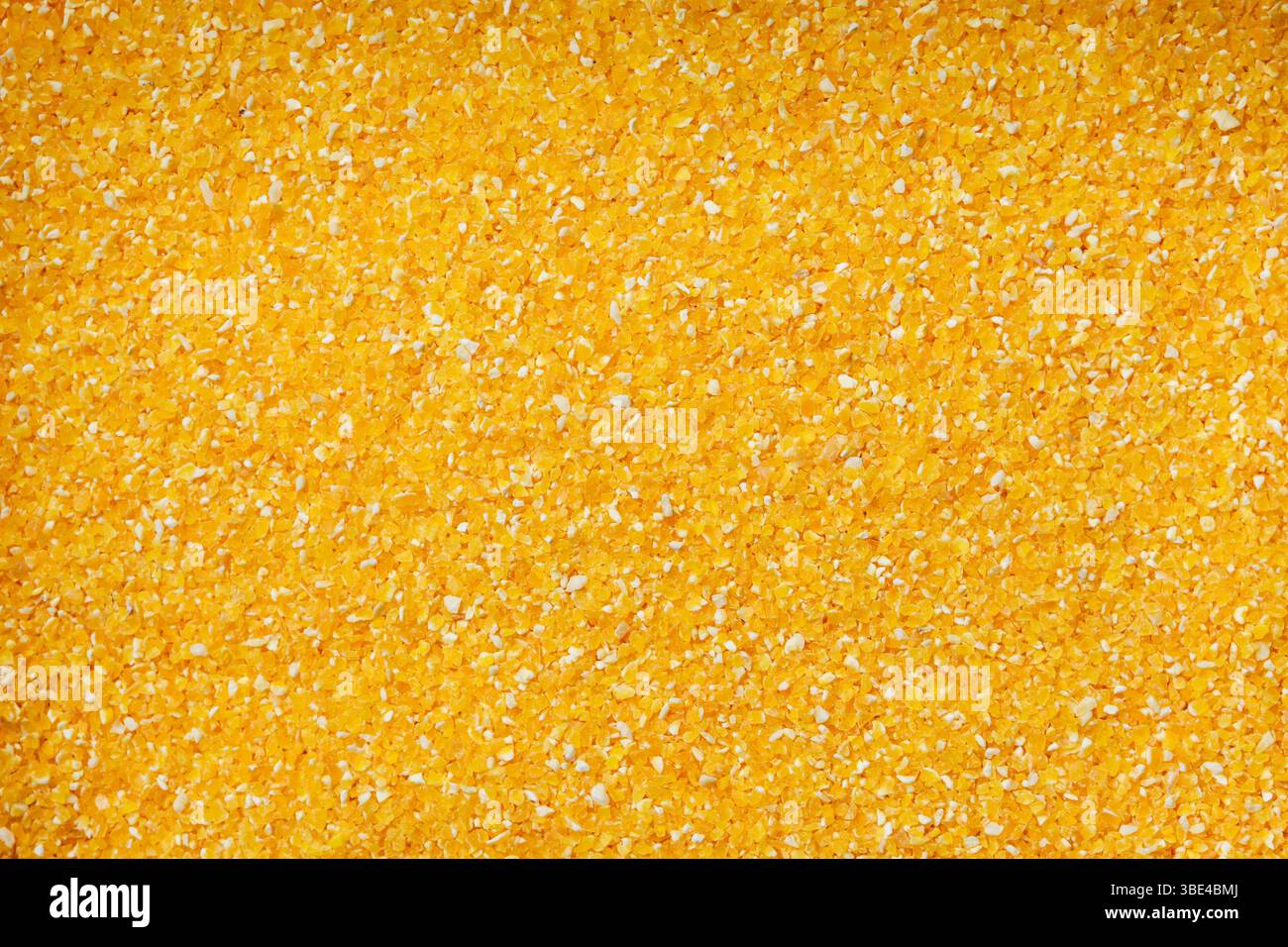 Maïs écrasé, texture, fond alimentaire. Banque D'Images