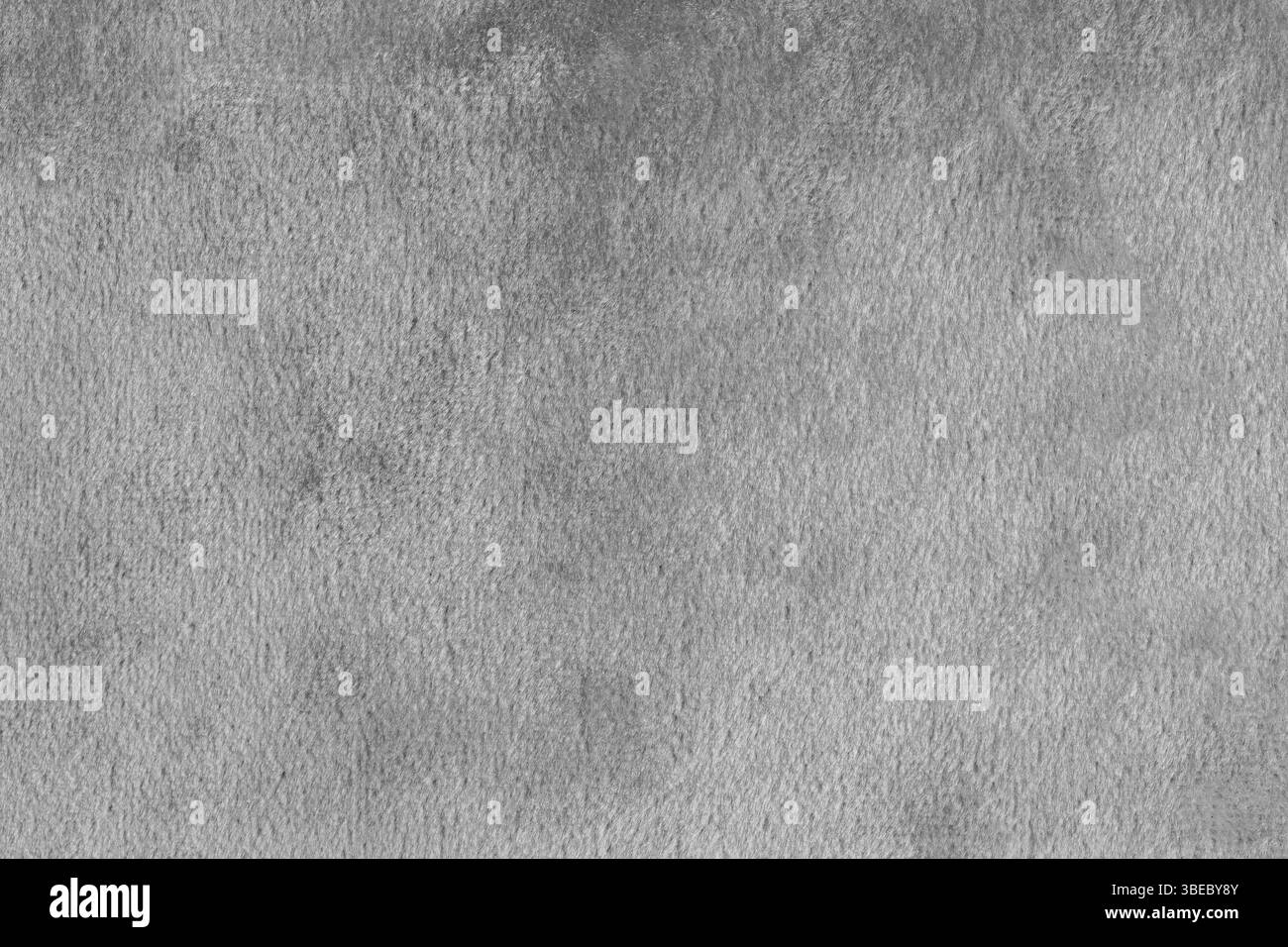 Fausse fourrure, tissu gris velours de soie brillant ou tissu macro, gros plan. Texture de tissu moelleux en matière textile de fourrure artificielle. Fond de canevas. Decorat Banque D'Images