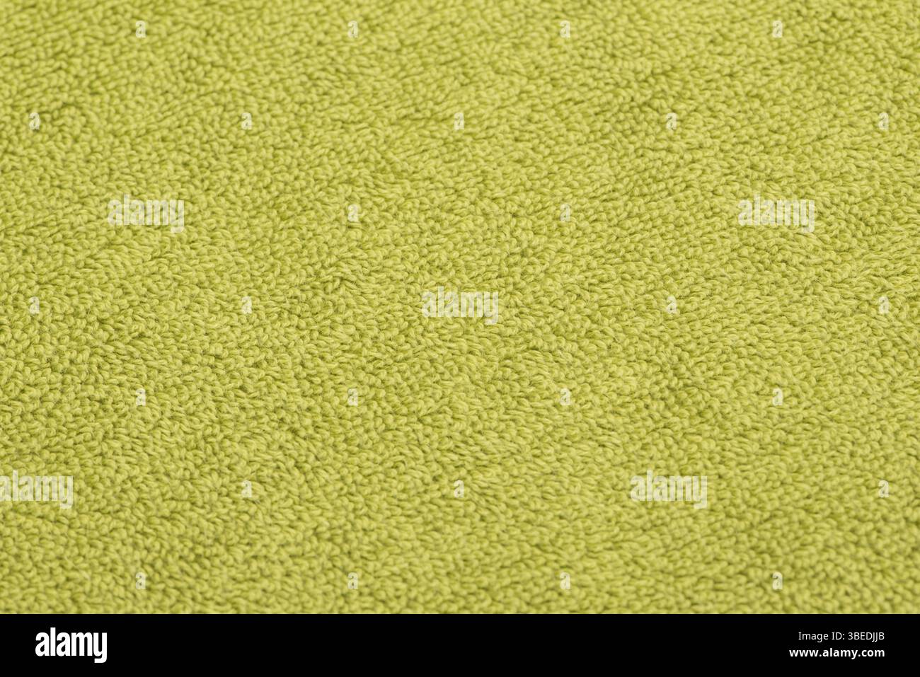 Serviette de bain vert vif. fond de tissu texturé Banque D'Images