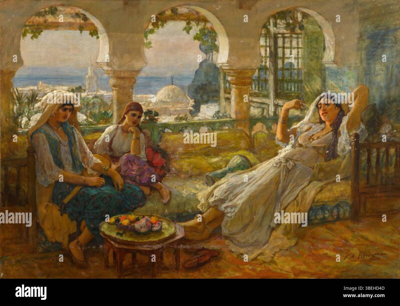 *On the Terrace* de Frederick Arthur Bridgman dépeint un moment de tranquillité sur une terrasse, mettant en valeur sa maîtrise dans la capture de cadres extérieurs sereins. La peinture met en valeur à la fois la beauté du paysage et le loisir des personnages présents. Banque D'Images