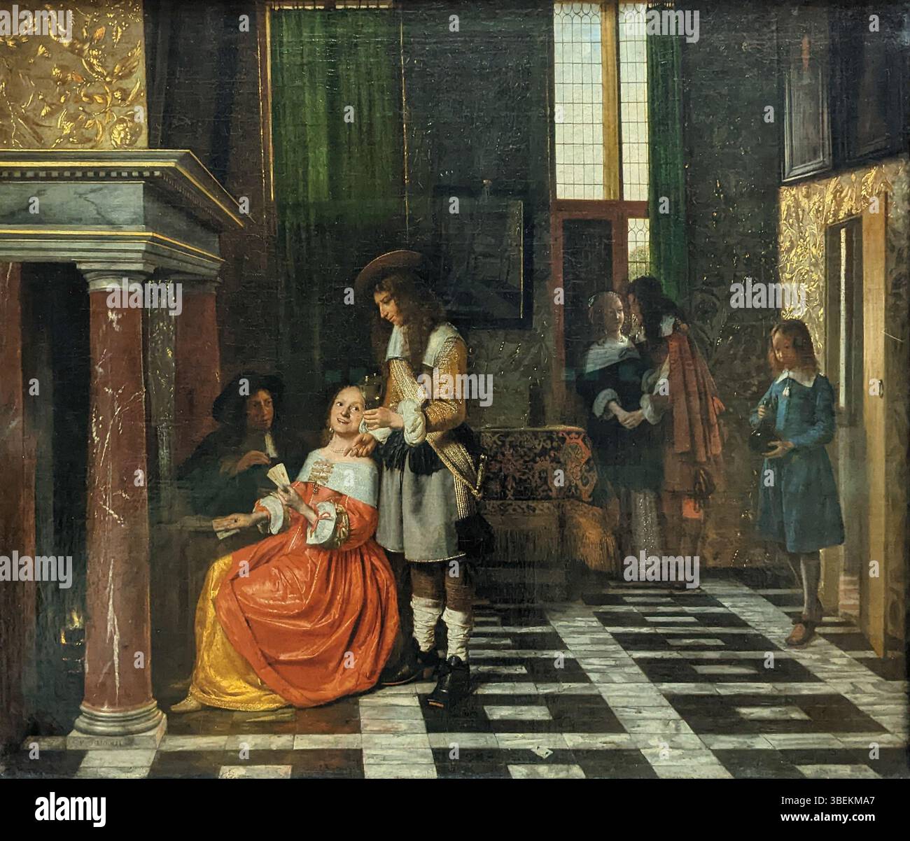 'Joueurs de cartes dans un riche intérieur' de Pieter de Hooch, peint en 1663, représente un groupe de personnages jouant aux cartes dans un intérieur hollandais richement meublé. L'œuvre illustre le talent de Hooch pour capturer la lumière, la profondeur spatiale et la vie domestique pendant l'âge d'or néerlandais. Banque D'Images