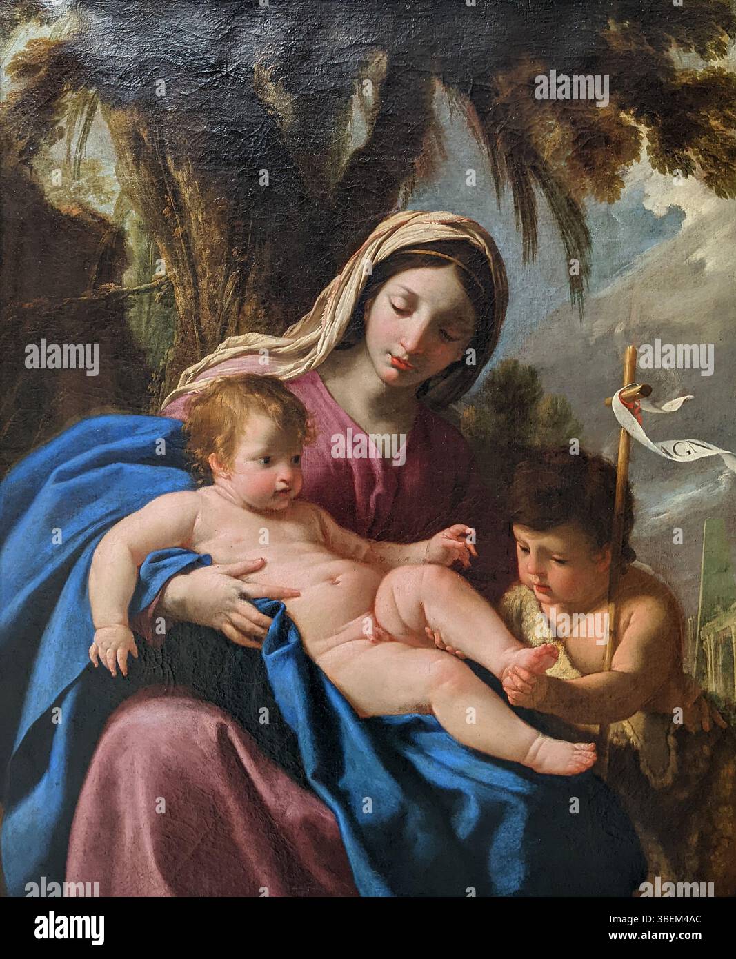 'La Vierge, l'enfant et Jean Baptiste enfant' d'Eustache le sueur, créée en 1635, représente la Vierge et l'enfant avec Saint Jean Baptiste comme enfants. La peinture illustre le baroque français Banque D'Images