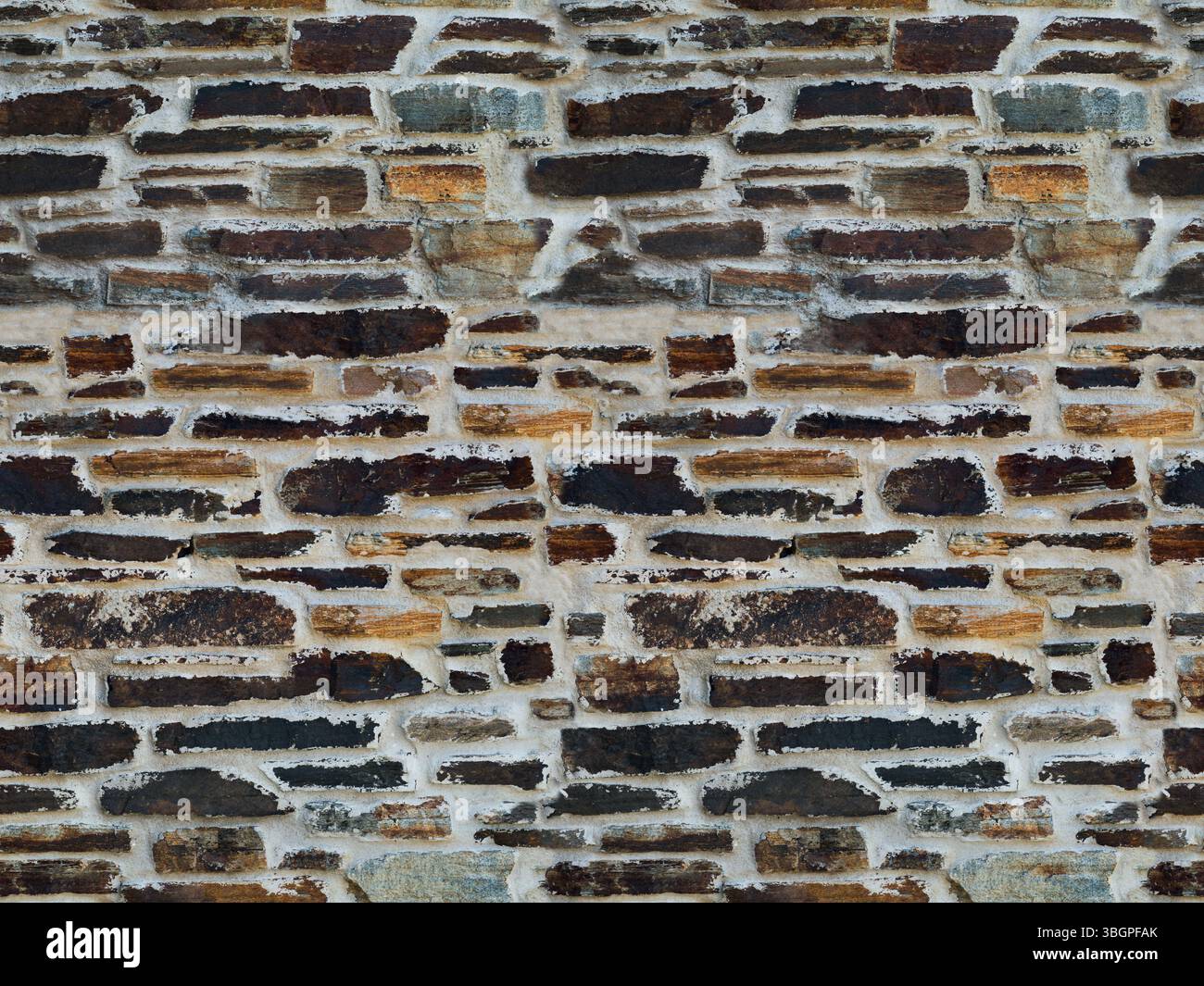 Fond de mur en pierre naturelle texture sans couture - différentes tailles de pierres d'ardoise altérées Banque D'Images