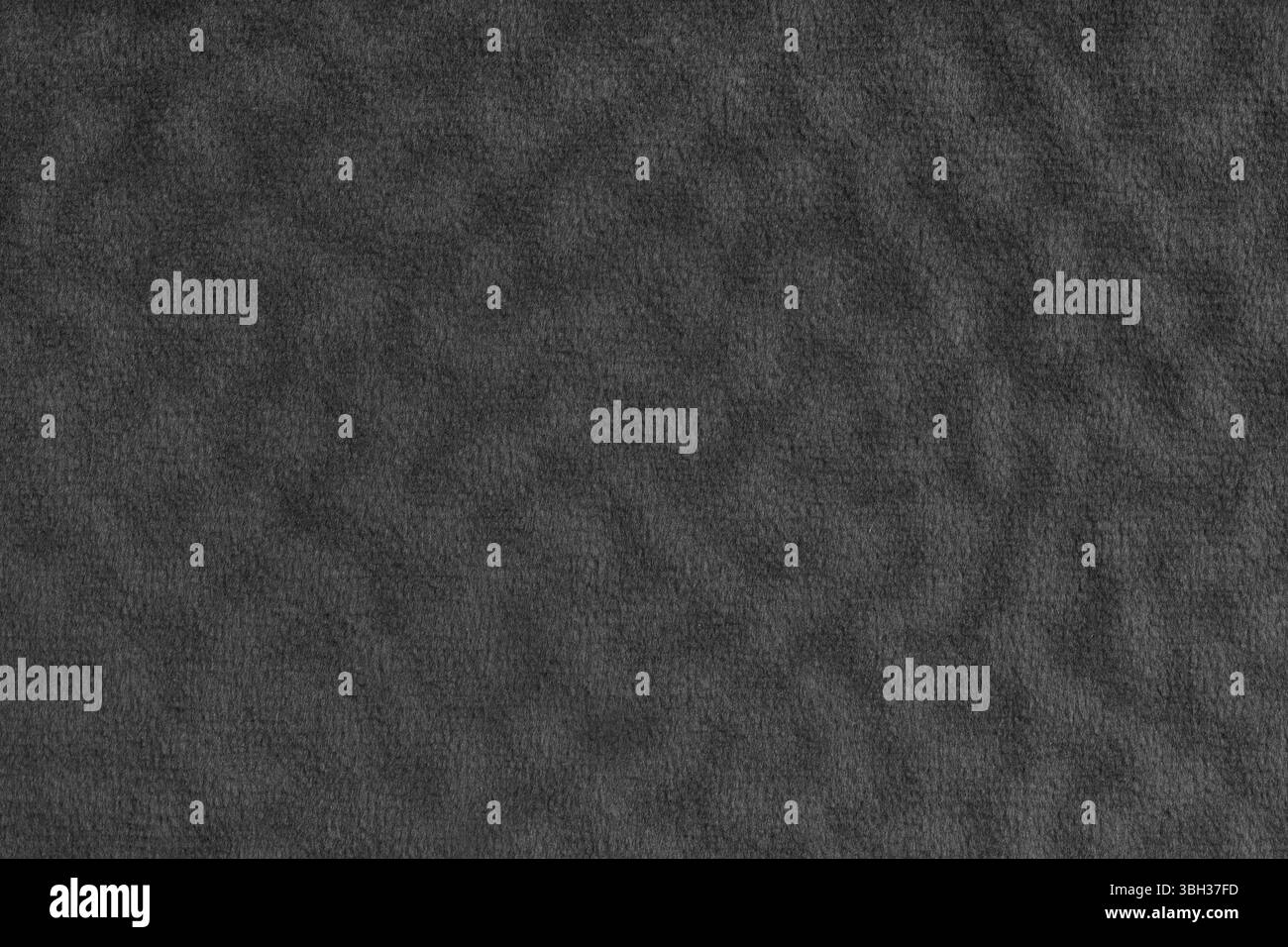 Fausse fourrure, velours tissu noir ou tissu à effet ondulé. Tissu moelleux de texture textile de fourrure artificielle macro. Fond de canevas. Decorativ Banque D'Images