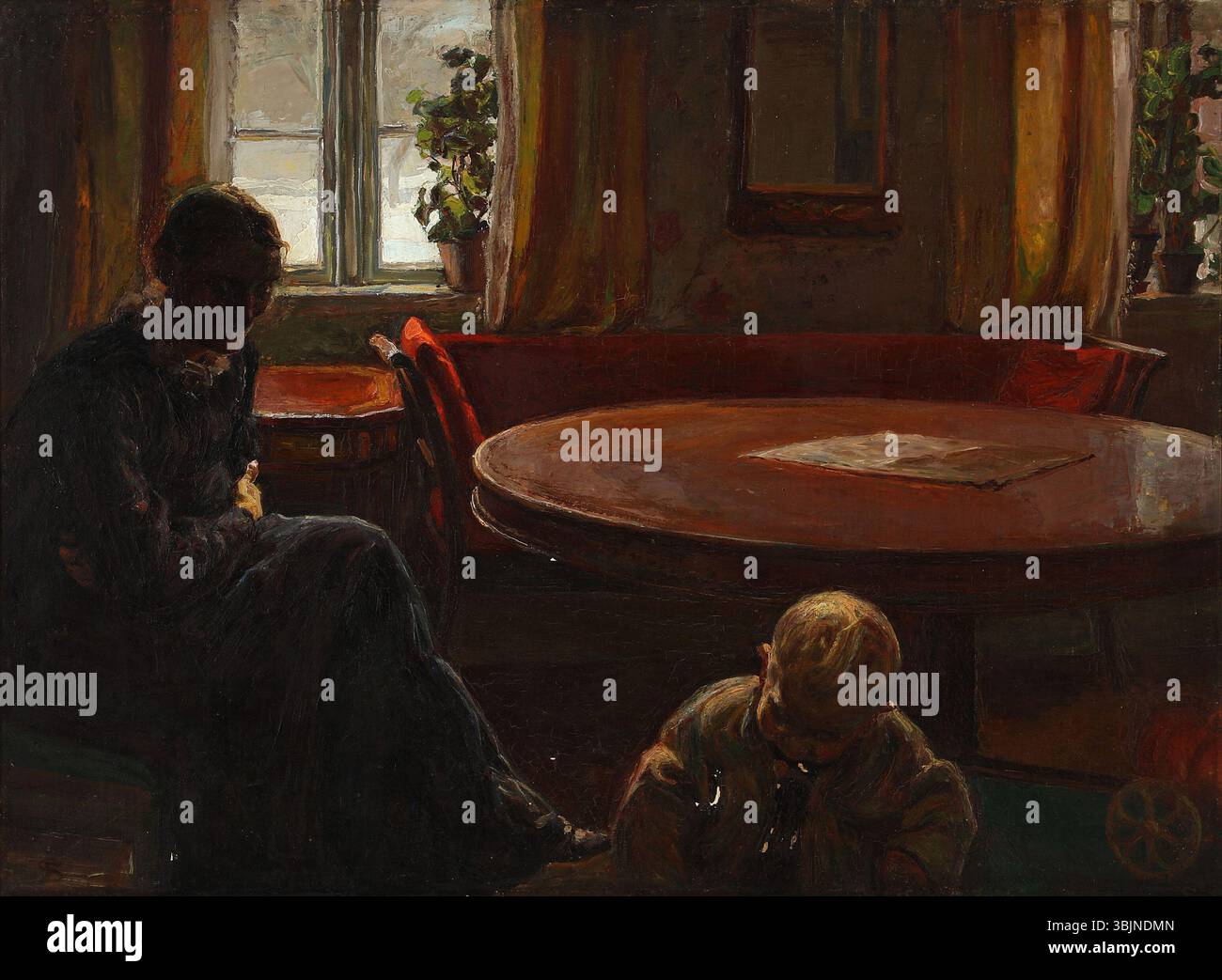 Le tableau de Fritz Syberg de 1905 représente sa femme, Anna Syberg, observant leur enfant jouer par terre dans une pièce. La peinture à l'huile sur toile reflète la vie familiale intime et l'aspect nourrissant de l'enfance. Banque D'Images