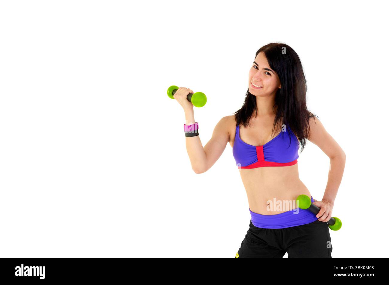 Jeune instructeur de fitness sur fond blanc en studio Banque D'Images