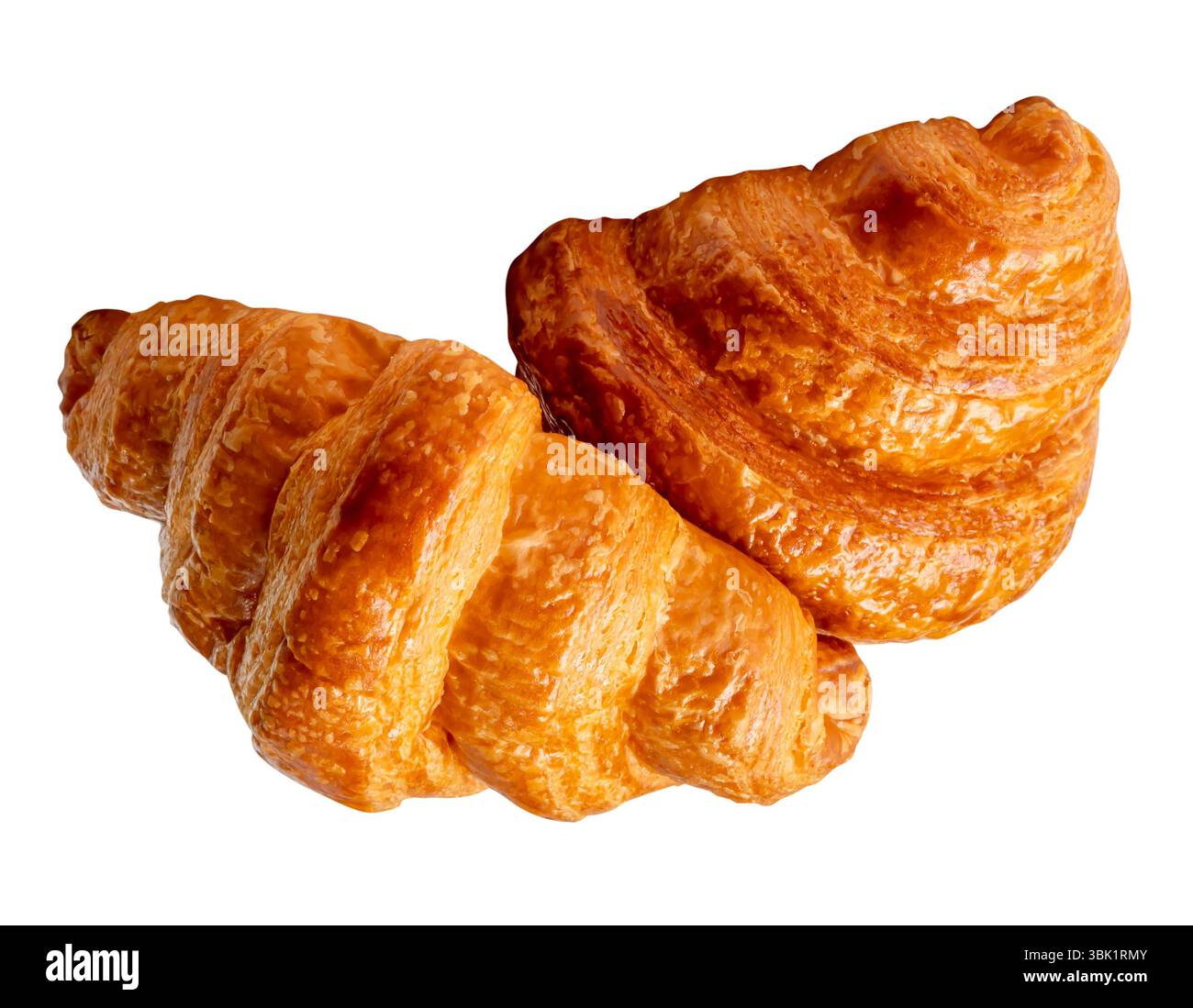 Vue de côté de deux pains bruns ou dorés de croissants en pile ou en tas est isolé sur fond blanc avec chemin de détourage. Banque D'Images