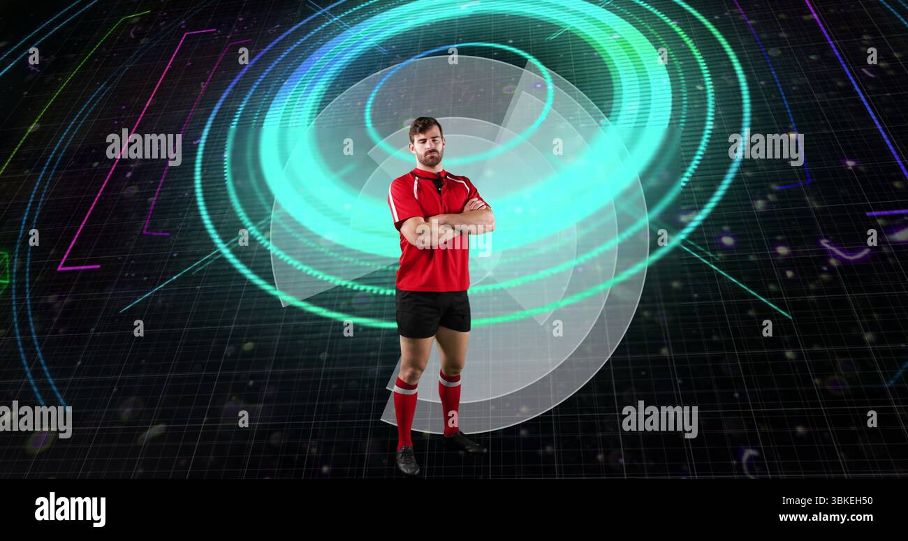 Athlète masculin debout portant un kit de sport rouge dans un espace d'entraînement virtuel, avec des anneaux holographiques Banque D'Images