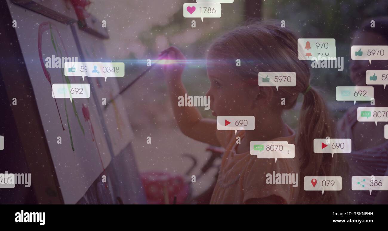 Deux filles d'âge scolaire peignant des traits colorés sur des chevalets dans le coin art à la maison, avec des icônes de réaction Banque D'Images