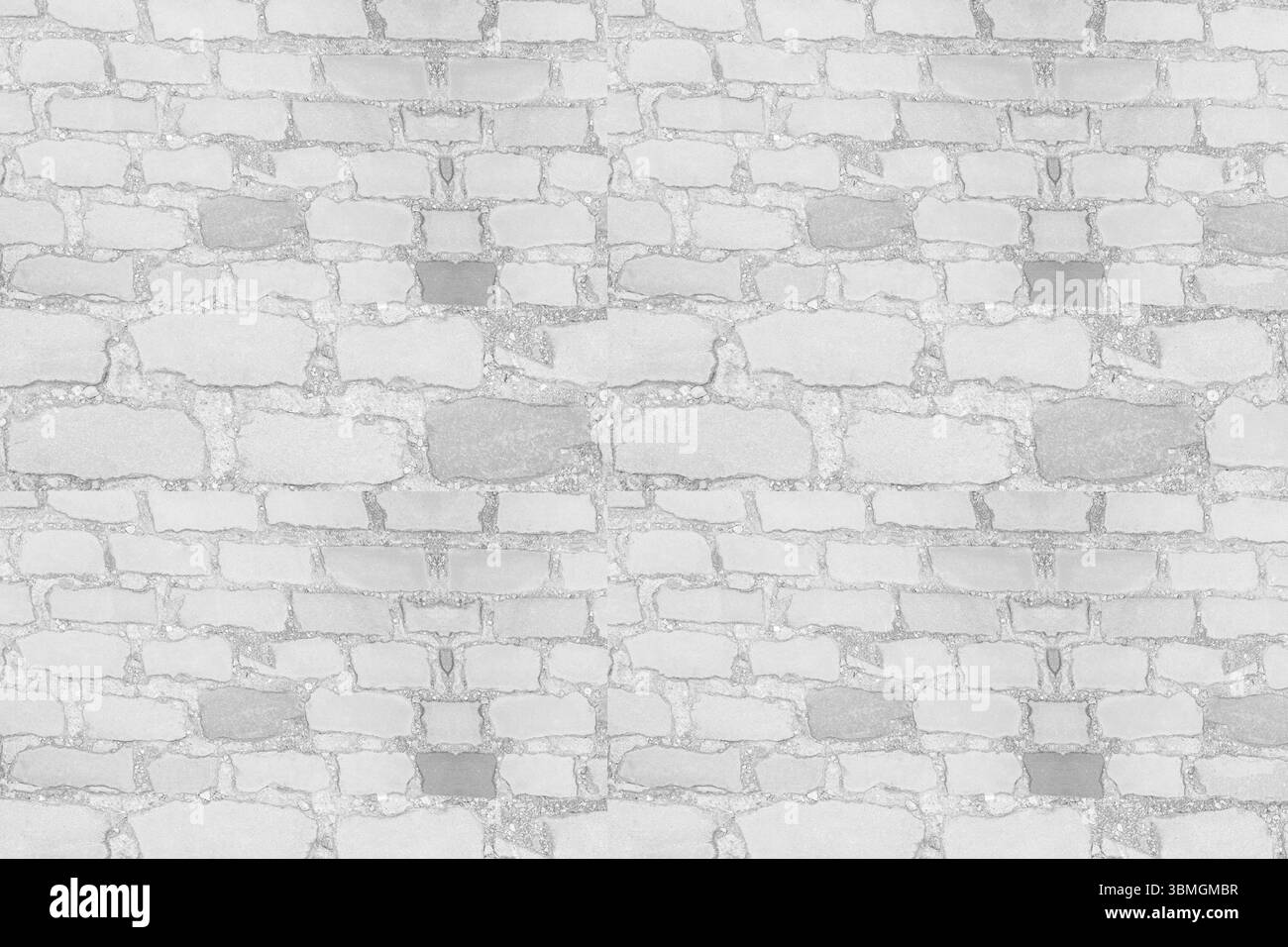 La surface du mur de pierre apparaît dans un design plat, montrant des pierres irrégulières et des joints de mortier Banque D'Images