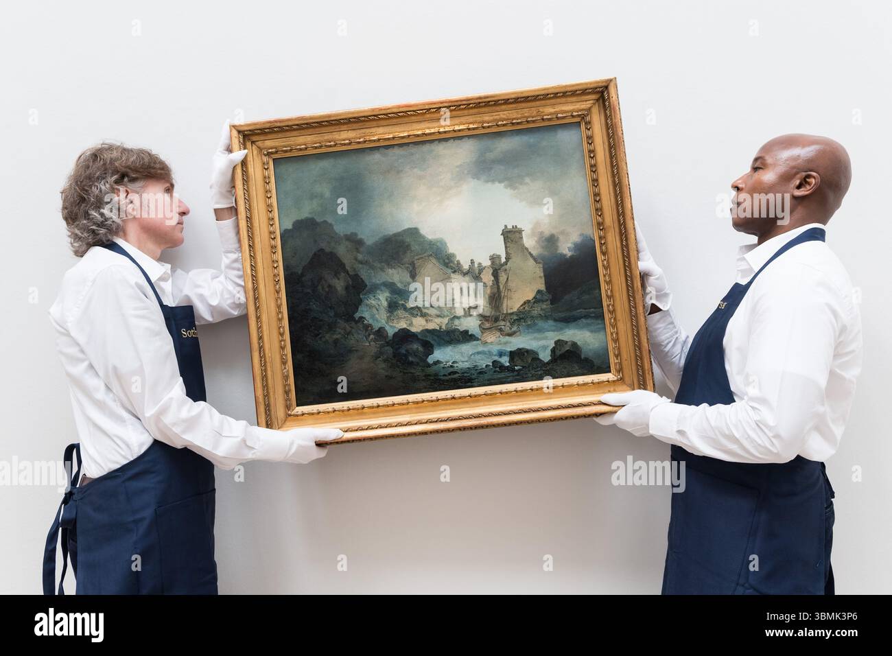 LONDRES, ROYAUME-UNI - 27 JUIN 2025 : les gestionnaires d'art détiennent une peinture redécouverte qui sera vue en public pour la première fois en plus de 150 ans intitulée 'The Rising Squall, Hot Wells, from St Vincent's Rock, Bristol' par Joseph Mallord William Turner, estimation : £200 000 - 300 000 lors d'un appel photo à la maison de vente aux enchères Sotheby's avant Old Masters Sale à Londres, Royaume-Uni le 27 juin 2025. (Photo de Wiktor Szymanowicz/NurPhoto) Banque D'Images