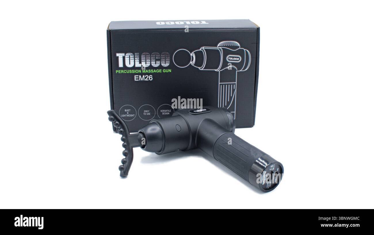 Pistolet de massage Toloco EM26 avec accessoires assortis pour athlètes massage profond du dos en tissu pour soulager la douleur. Masseur à percussion électrique, couleur noire, est Banque D'Images