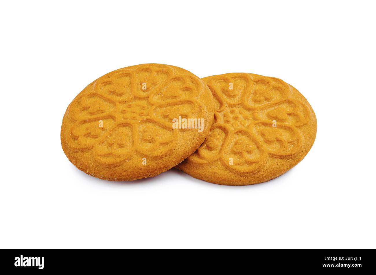 Nature morte, deux biscuits dorés aux motifs floraux détaillés sont placés côte à côte. Leur texture croustillante et leur aspect invitant les rendent idéales Banque D'Images
