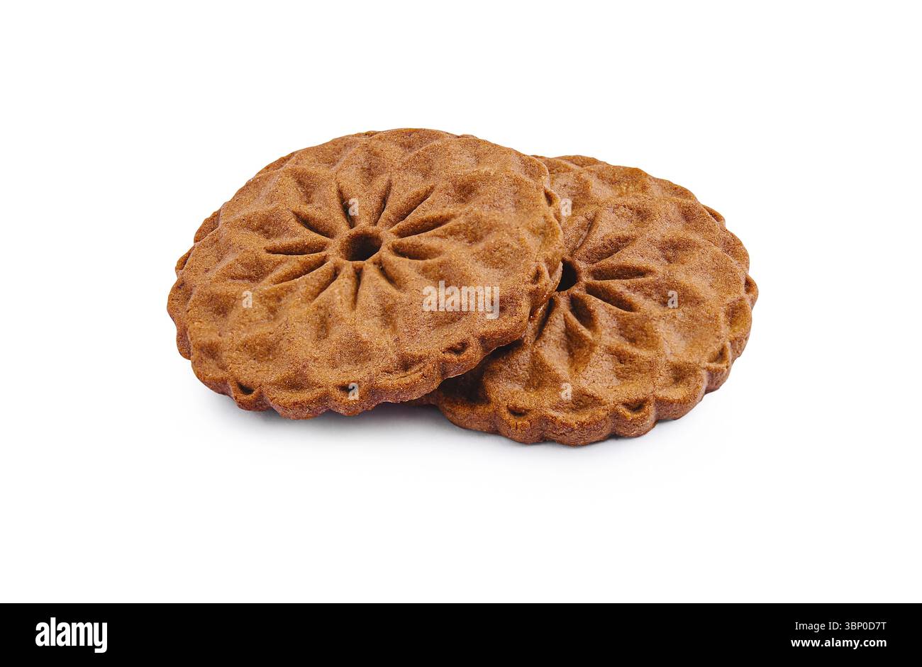 Nature morte, deux biscuits ornés aux motifs floraux se trouvent côte à côte. Leur couleur riche et brune suggère une bouchée douce et savoureuse, parfaite pour cel Banque D'Images