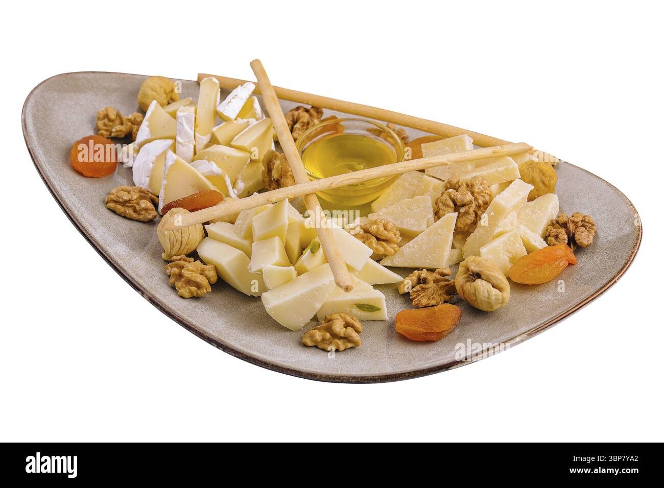 Nourriture, assiette de fromage avec noix et miel Banque D'Images