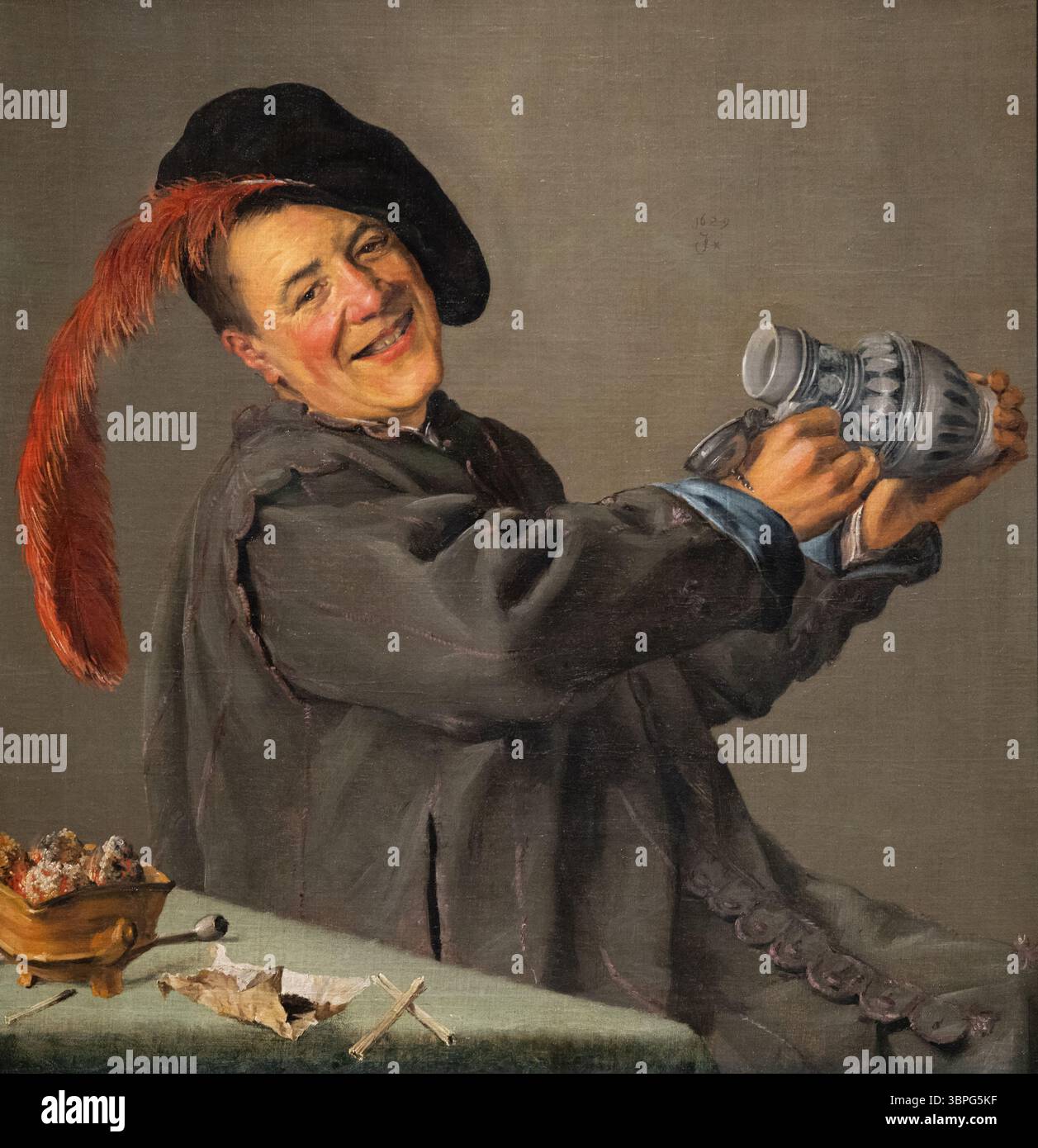 Judith Leyster peinture 'The Jolly Drinker', 1629, peintre néerlandaise du XVIIe siècle de l'âge d'or ; homme buvant de l'alcool ; peut-être alcoolique. Huile sur toile Banque D'Images