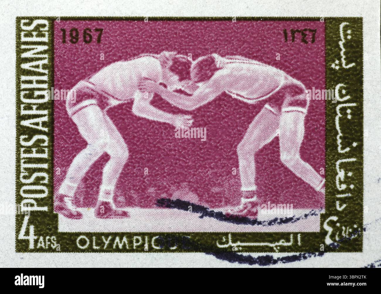 Lutte contre les lutteurs sur le vieux timbre-poste de l'Afghanistan Banque D'Images