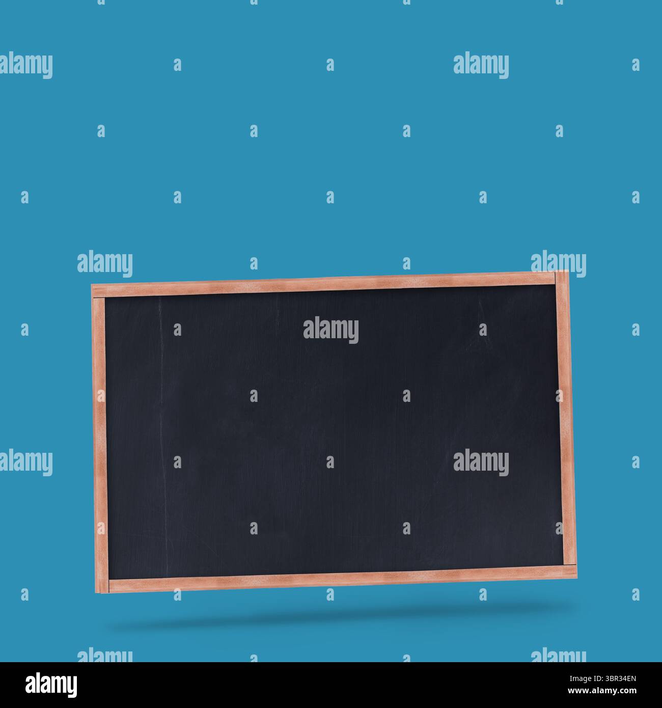 Tableau blanc planant dans un design plat sur fond sarcelle, avec cadre en bois et ombre portée Banque D'Images