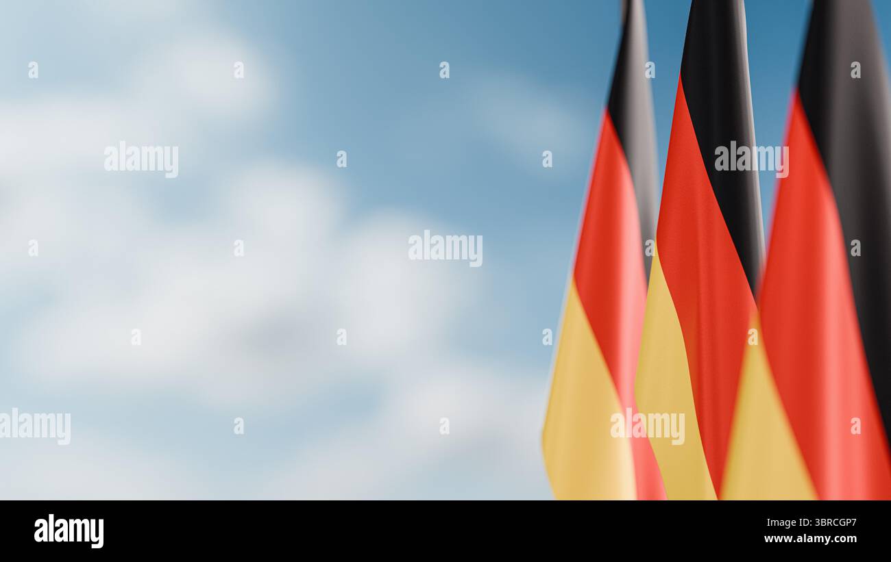 Trois drapeaux d'Allemagne, suspendus décorativement à un mât de drapeau Banque D'Images