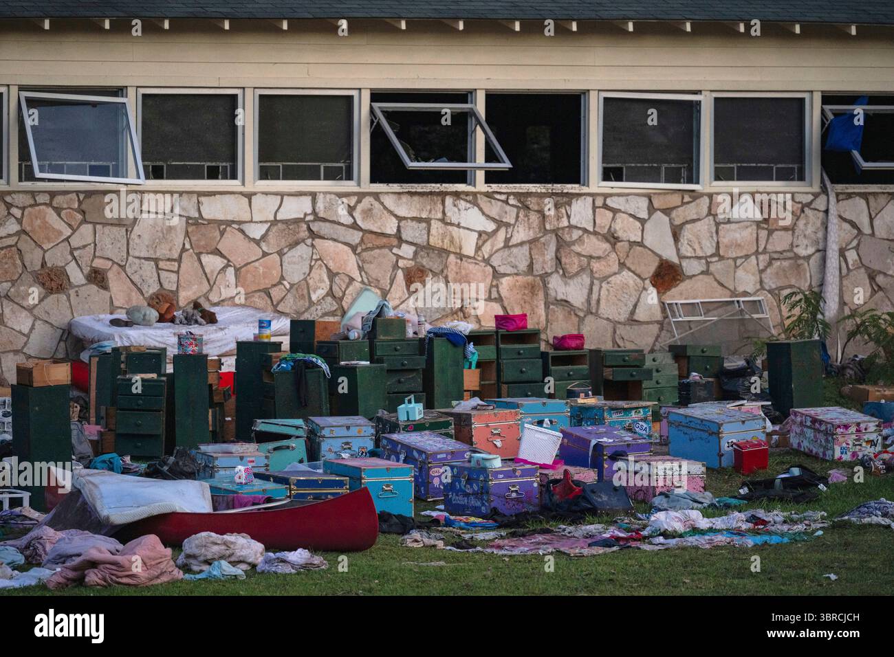 FILE - The belongings of campers sit outside one of Camp Mystic's cabins near the Guadalupe River in Hunt, Texas, on Monday, July 7, 2025, after a deadly flash flood swept through the area. (AP Photo/Eli Hartman, File) Banque D'Images