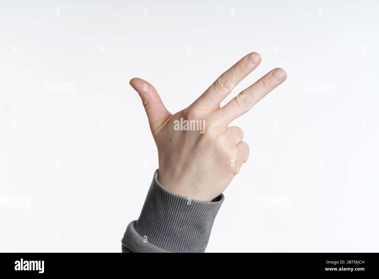 Main - 3 doigts - extérieur Banque D'Images