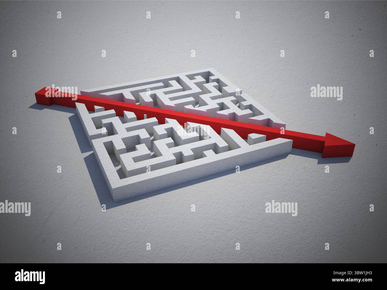 Flèche rouge coupant à travers puzzle Banque D'Images