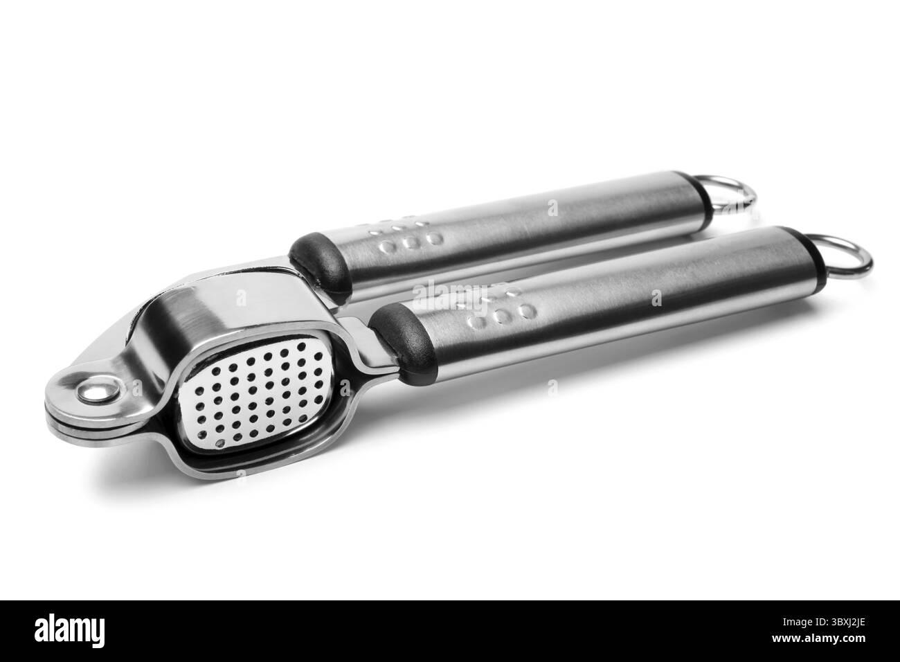 Presse à ail sur fond blanc Banque D'Images