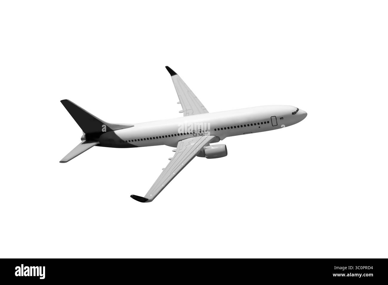 Avion de ligne de passagers volant isolé au-dessus d'un fond blanc Banque D'Images