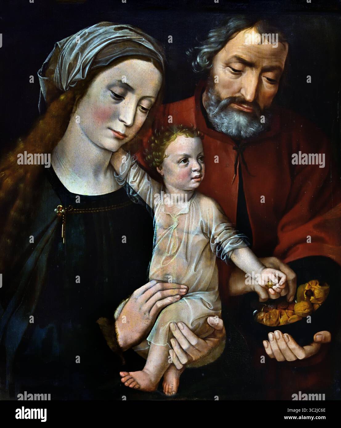 La Sainte famille 1525-1530, XVIe siècle par Ambrosius Benson Ambrosius Benson (1495/1500-1550) Groeningemuseum, musée municipal, Bruges, Belgique, flamand, ( la Sainte famille dans une scène domestique représentant Jésus comme un enfant dans les bras de sa mère, Marie. Il a son bras droit autour de son cou, et de sa main gauche il prend une noix dans un bol que lui a offert Joseph.) Banque D'Images