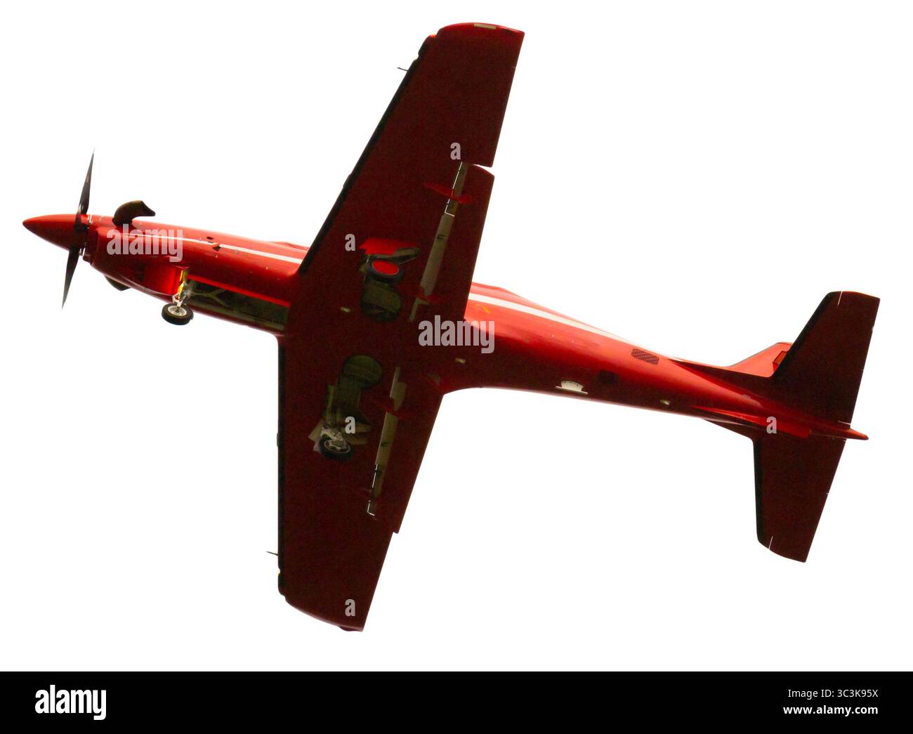 Avion rouge monomoteur à aile basse isolé Banque D'Images