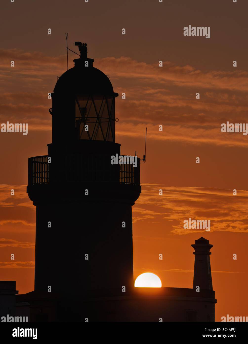 Lever de soleil sur le phare de Chanonry point sur le Moray firth, en Écosse Banque D'Images