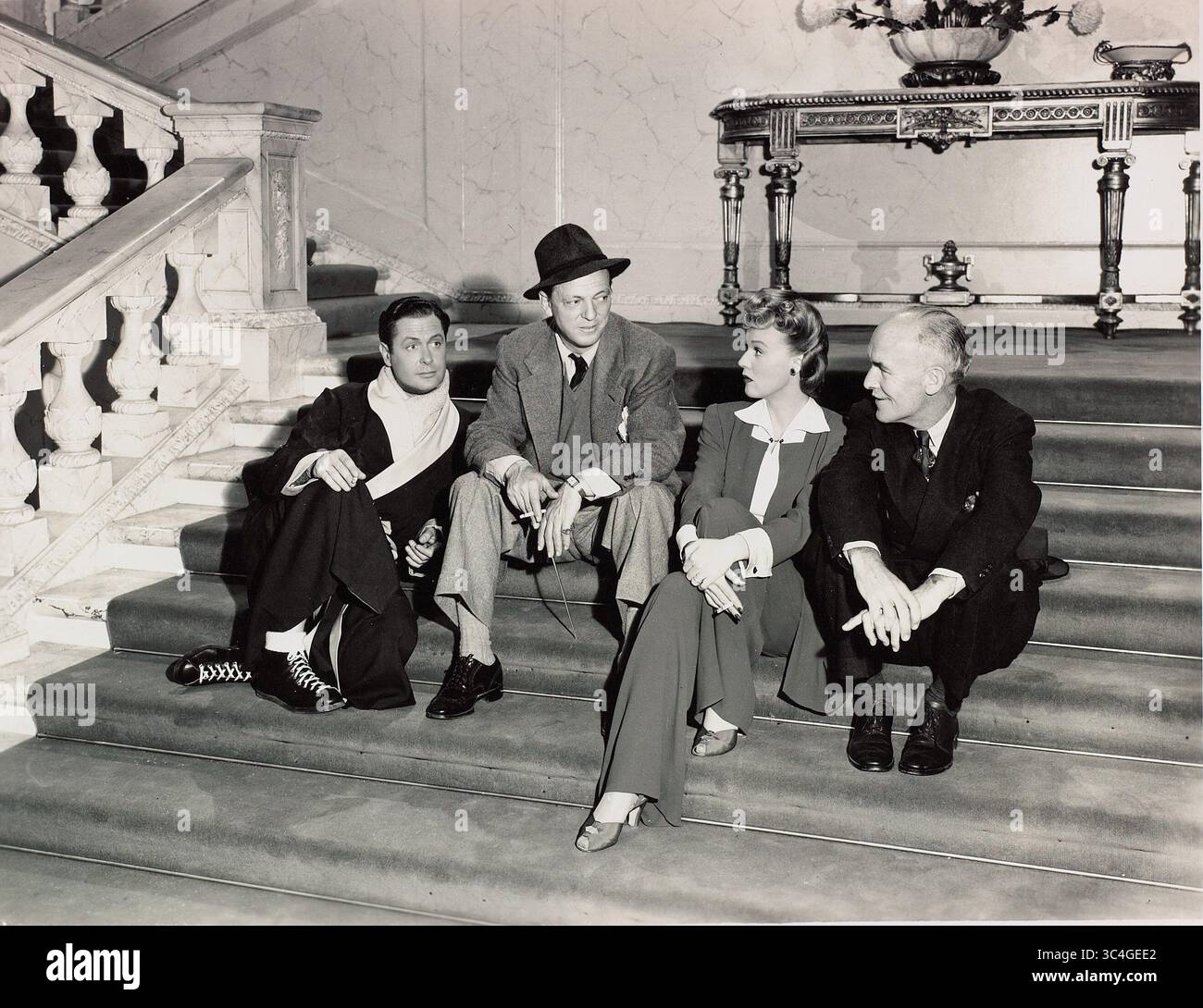 Publié : 23 Juil., 1941 - Film Original Titre : Voici M. Jordan. Sur la photo : ALEXANDER HALL, Robert Montgomery, Rita Johnson, James Gleason. Banque D'Images