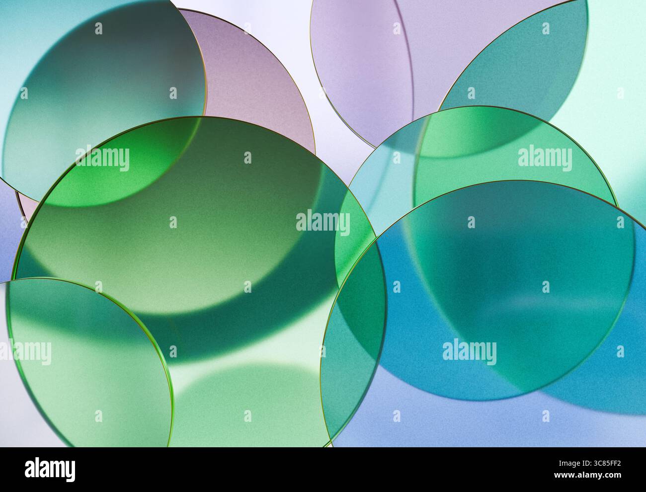 Rendu 3D de disques transparents en verre vert et bleu superposés création de motifs abstraits doux sur un arrière-plan clair Banque D'Images