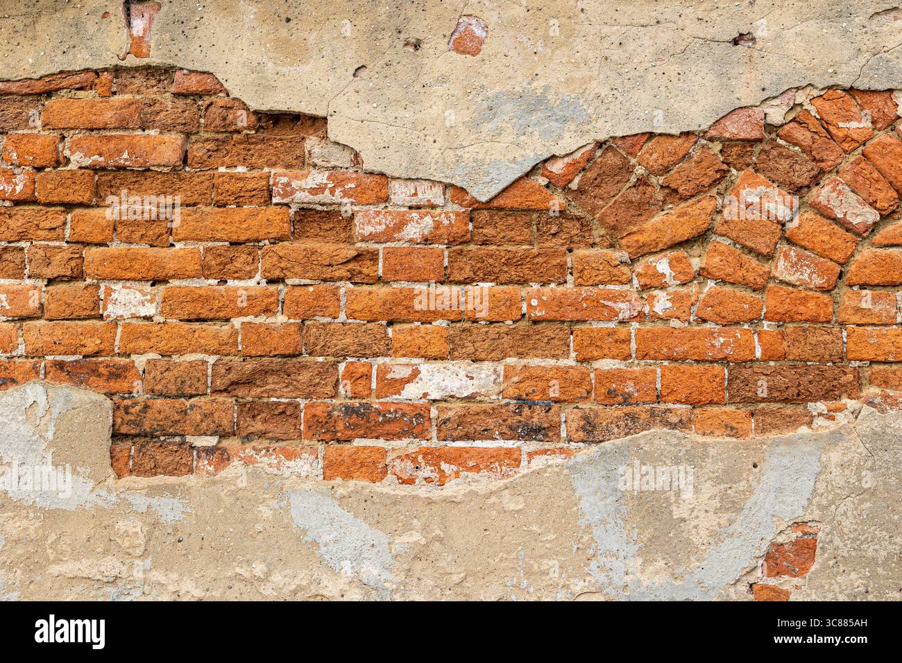 La brique apparente sur un ancien bâtiment médiéval en Europe fait un élément de plaque de fond intéressant. Banque D'Images