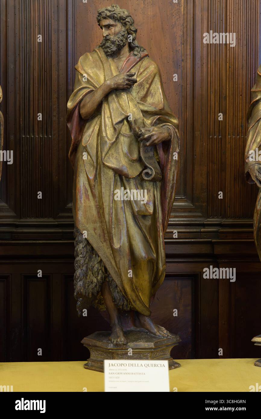 Sculpture polychrome en bois 'San Giovanni Battista' (1415-1420) de Jacopo della Quercia, Museo dell'Opera del Duomo, Sienne, Italie. Banque D'Images
