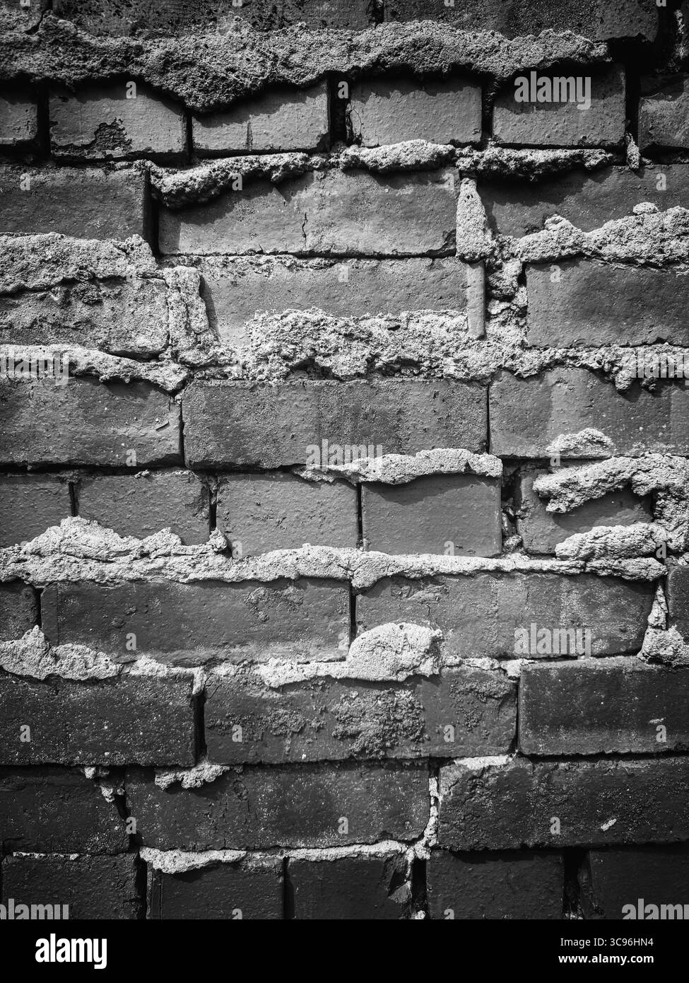 Détail d'un mur de briques en noir et blanc Banque D'Images