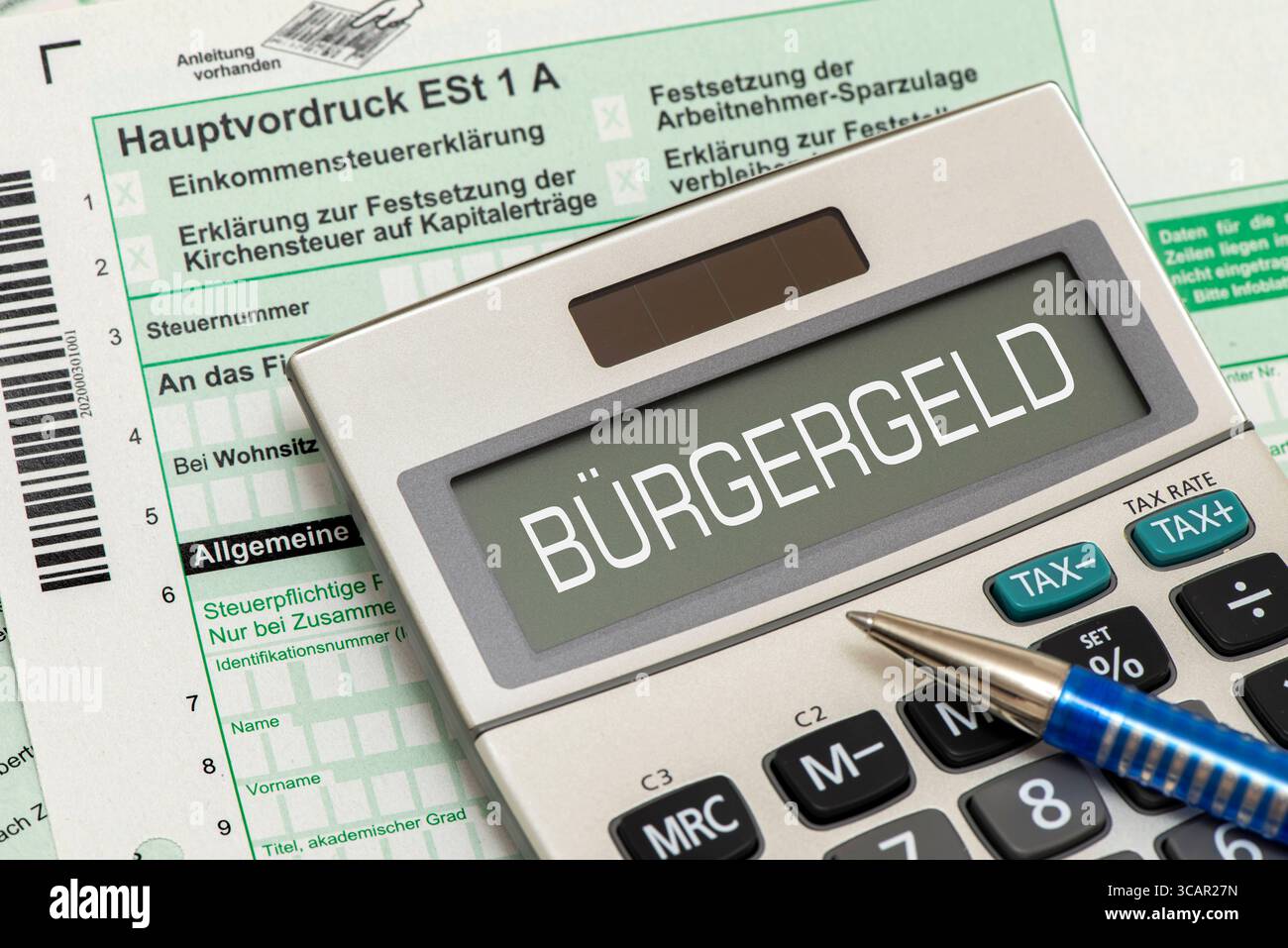 Bürgergeld als Grundeinkommen Das Display von einem Taschenrechner ist beschriftet mit Bürgergeld als Symbol für Grundeinkommen *** citoyens revenu AS Banque D'Images