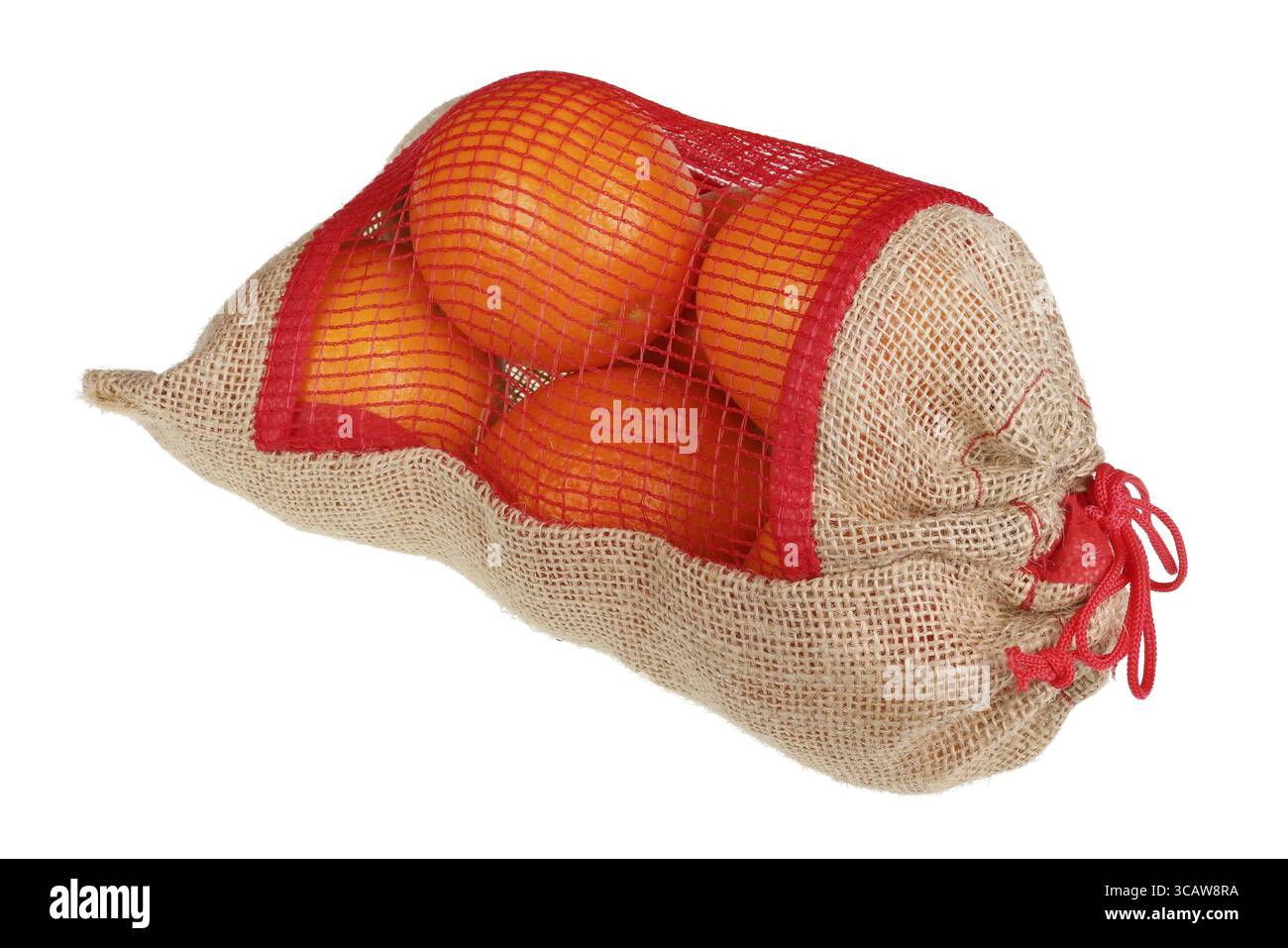 Les oranges de Noël dans une maison rustique toile sac. Gros plan studio isolated on white Banque D'Images