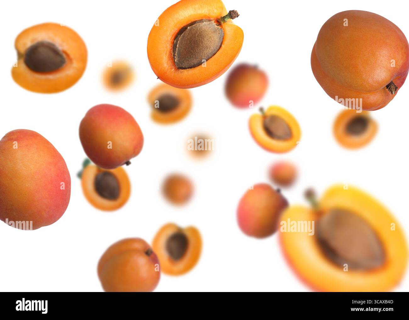 Abricots frais tourbillonnant dans l'air sur fond blanc Banque D'Images
