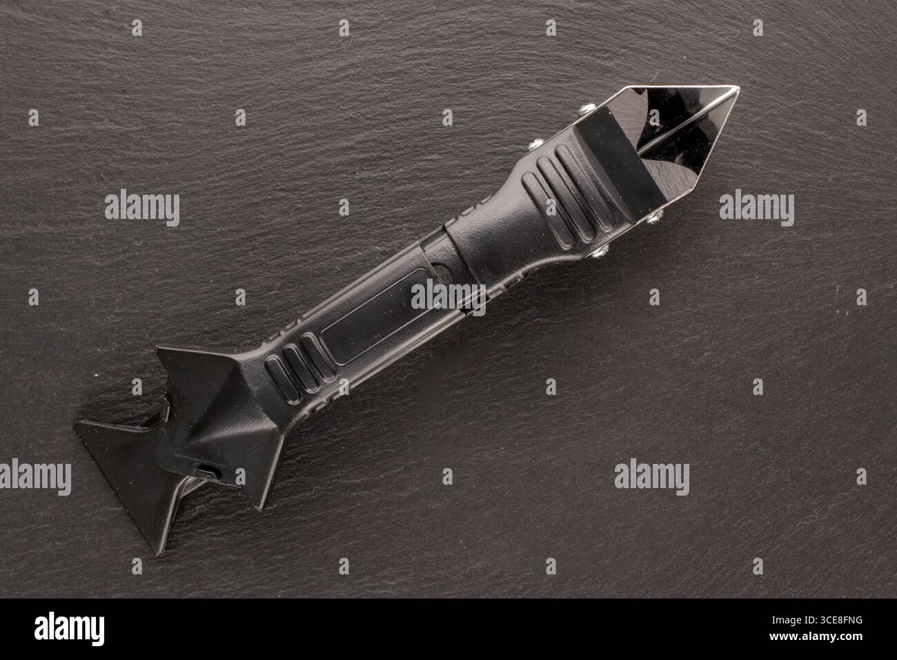 Outil de dépose et de mise à niveau du mastic d'étanchéité, macro, vue de dessus. Banque D'Images