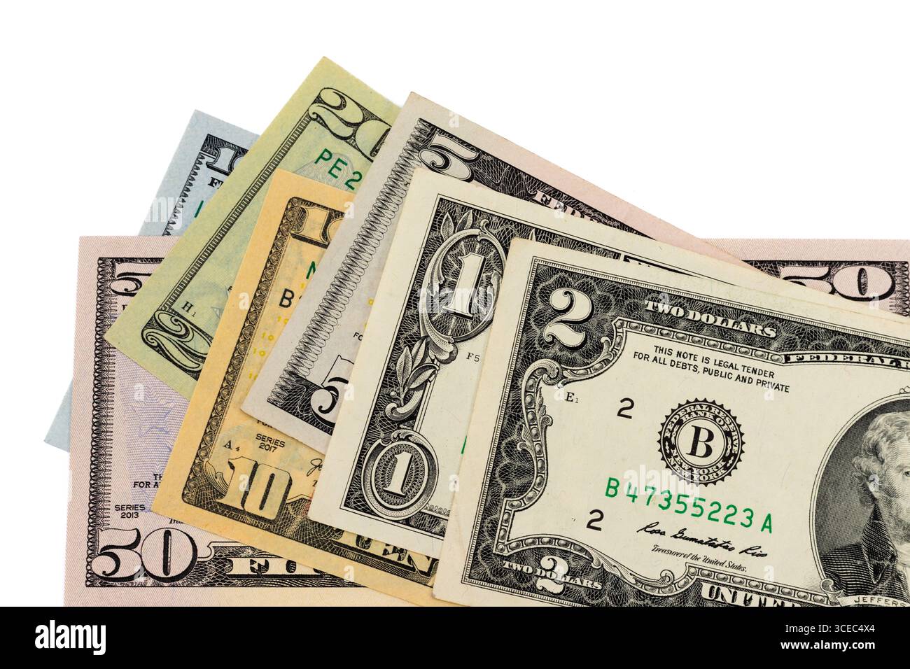 Billets de banque mélangés en dollars américains de différentes coupures isolés sur fond blanc Banque D'Images
