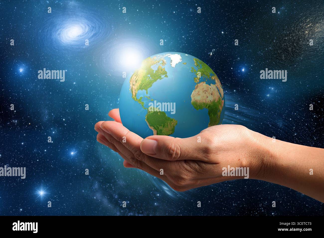 Mains humaines berçant la Terre, symbolisant l'harmonie, la responsabilité écologique et l'espoir d'un monde durable. Banque D'Images