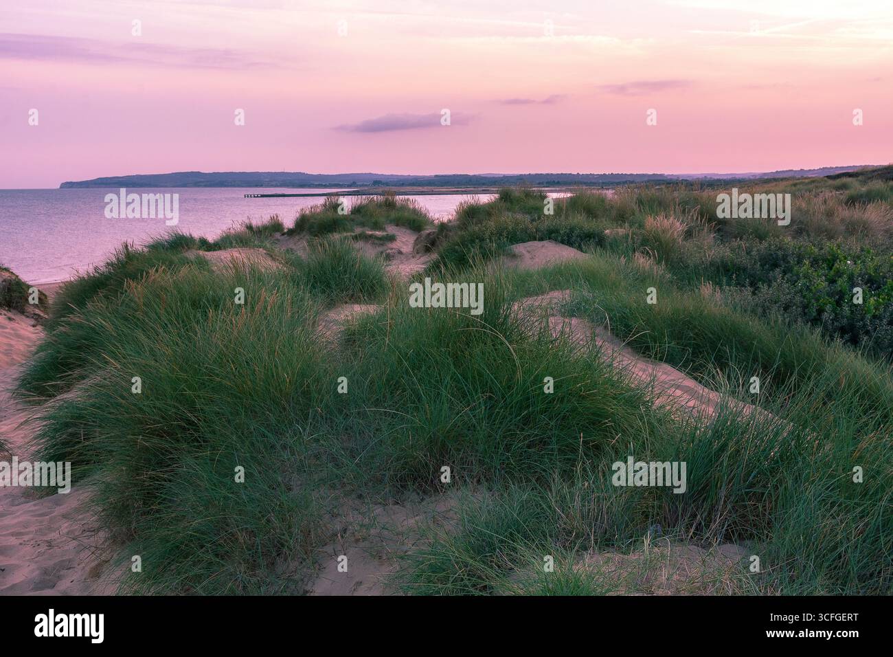Camber Sands au coucher du soleil, East Sussex, Angleterre, Royaume-Uni. Bord de mer anglais. Banque D'Images
