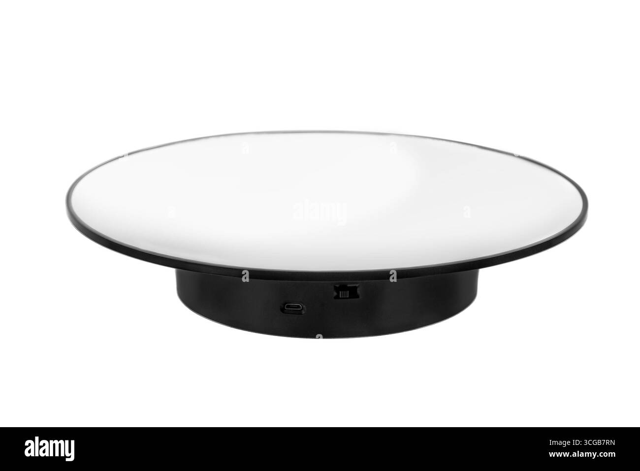 Un petit présentoir rotatif noir et blanc rond, susceptible de présenter des produits, isolé sur un fond blanc propre. Banque D'Images