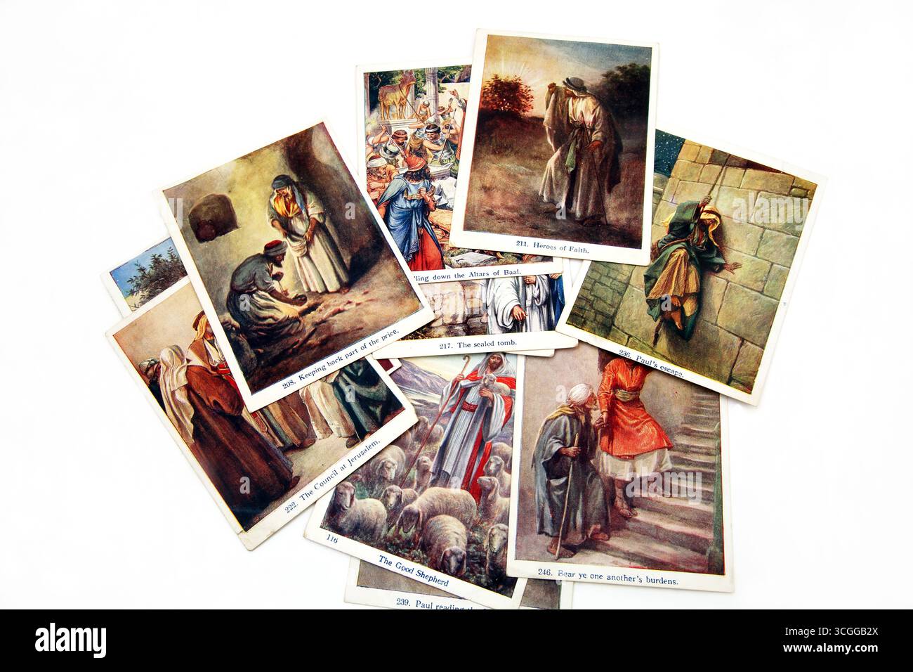 Une pile de cartes illustrées de l'ancien et du Nouveau Testament tirées des images de leçon de la Bible du 20e siècle (les images de leçon des enfants) Union de l'école du dimanche Banque D'Images