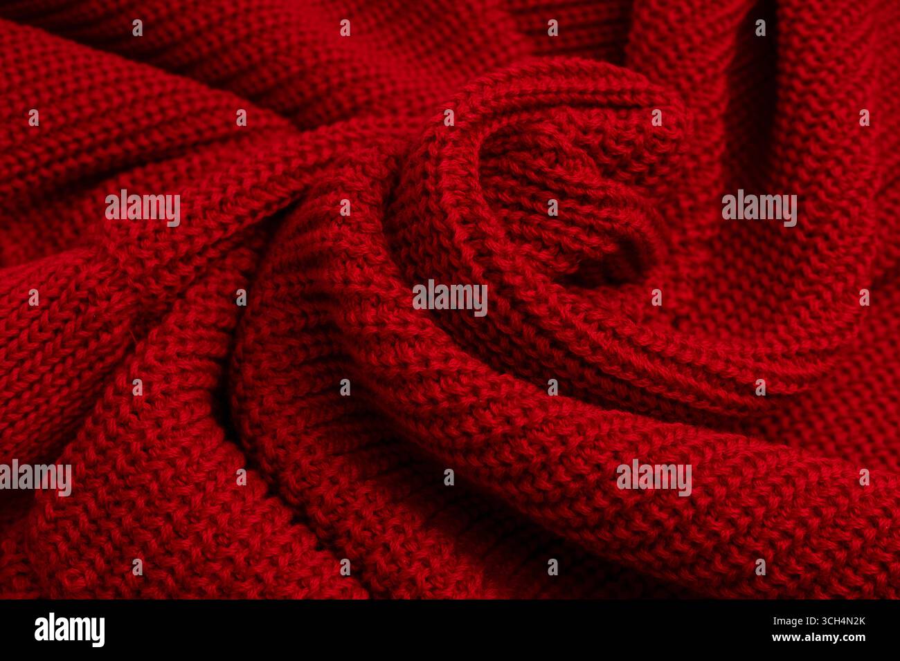 Texture de pull rouge comme fond. Vue de dessus Banque D'Images