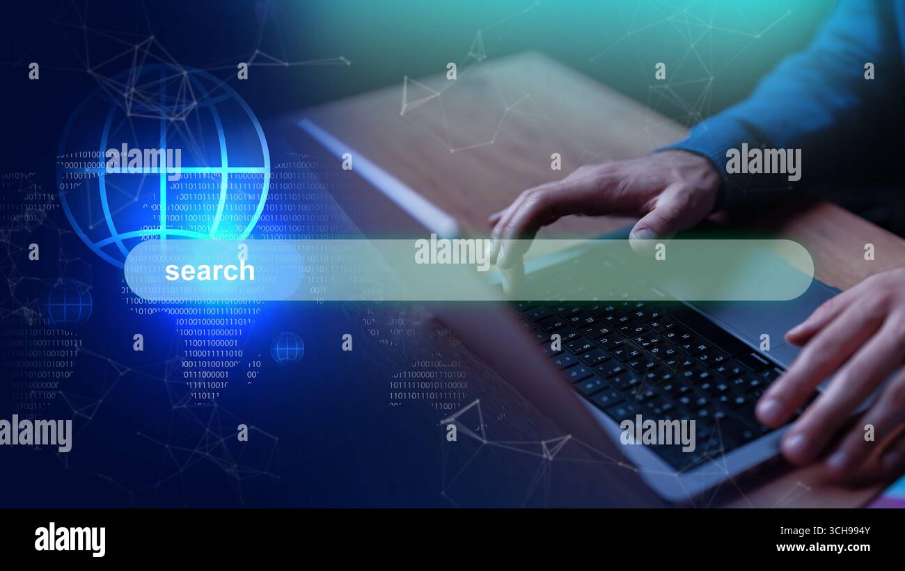 Utilisateur tapant sur un ordinateur portable avec une interface numérique affichant une barre de recherche et la visualisation des données Banque D'Images